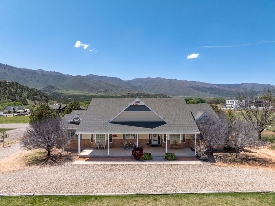 Tucked away in the peaceful countryside of New Harmony, this inviting 4 bedroom, 3 bath home offers 2,330 square feet of comfortable living on a spacious .92 acre lot. Surrounded by wide open space and natural beauty, the property captures the essence of quiet, rural living while still providing modern convenience.

Step inside to find a thoughtfully designed layout with generous living areas, ideal for both everyday living and gathering with family and friends. Large windows invite in natural light and frame the stunning views that stretch across the surrounding landscape.

Outside, the nearly one acre property provides plenty of room to enjoy the outdoors whether it's creating your dream garden, adding a shop, or simply relaxing and taking in the peaceful setting. With breathtaking views, open skies, and a sense of seclusion, this property offers a rare opportunity to enjoy the slower pace and beauty of Southern Utah living.

If you're looking for space, privacy, and incredible scenery, this New Harmony home delivers it all.