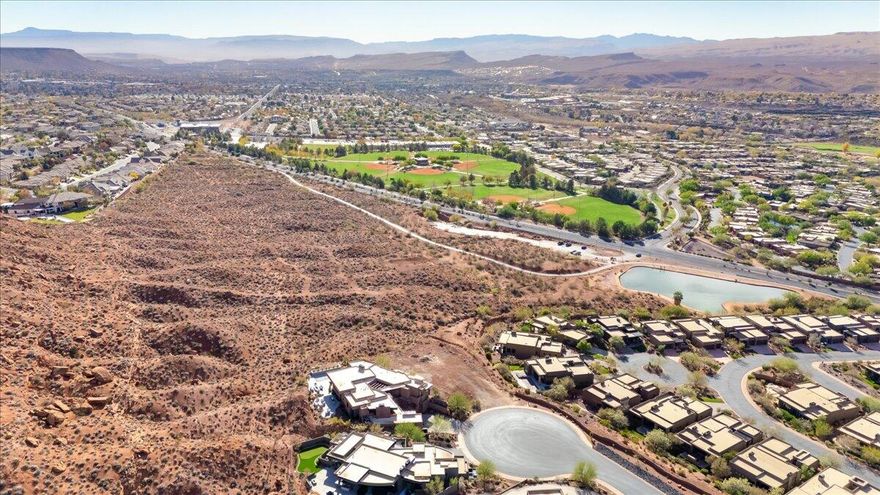 Set on a peaceful cul-de-sac in the prestigious Vistas at Entrada community, this exceptional .62 acre homesite offers the opportunity to create a truly remarkable custom residence surrounded by some of Southern Utah's most breathtaking scenery. Elevated above the neighboring rooftops, the property captures sweeping 270 degree panoramic views of Snow Canyon, Red Mountain, layered desert mesas, and the sparkling city lights of St. George stretching across the valley below.

The lot's generous size and natural topography provide the perfect foundation for a luxury architectural masterpiece designed to maximize indoor outdoor living, expansive walls of glass, and beautifully integrated outdoor spaces. Backing to a protected tortoise reserve, the homesite offers rare privacy and the assurance of no future development directly behind you.

Surrounded by stunning modern estates, this setting delivers a dramatic yet peaceful atmosphere with ever changing desert skies, glowing sunsets, and unforgettable twilight views. Located within the sought after Entrada at Snow Canyon community, residents enjoy access to world class amenities including championship golf, pickleball, tennis, resort style pools, fitness facilities, dining, and miles of scenic walking and biking trails, all moments from Snow Canyon State Park.

As one of the final remaining homesites in this coveted luxury enclave, this is a rare opportunity to build a legacy property in one of St. George's most exclusive communities.