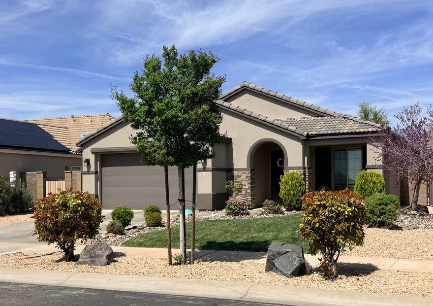 Wonderful home in Highland Park @ Coral Canyon.  Recently the flooring was updated to LVP and new carpets & pad. Great room has extra high vaulted ceilings and custom built in cabinet.  4 bedrooms and a private den / office.  Extra kitchen  counter space and laundry / mudroom with bench and hooks.  The sellers extended the already oversized patio with additional concrete to give plenty of outdoor living space on the NE side of the home for amazing shade most of the day.  The large backyard is big enough for a future pool, etc.