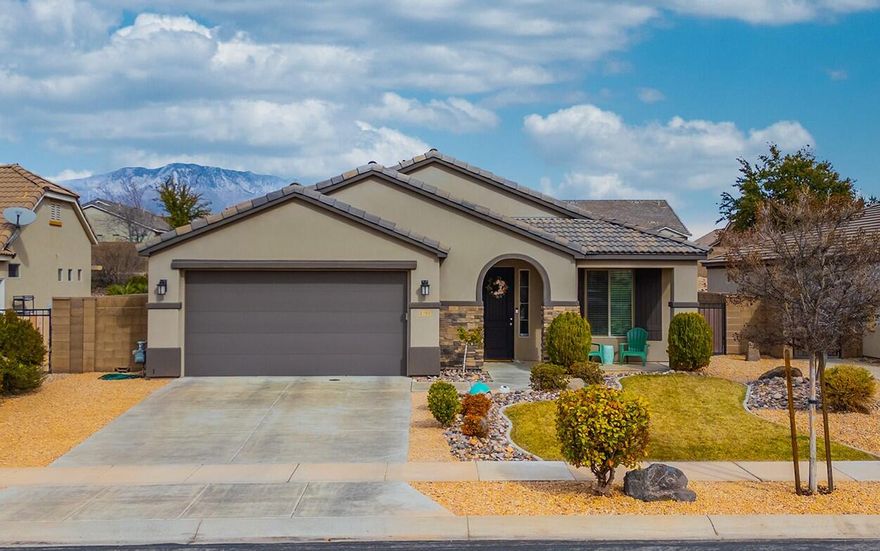 Wonderful home in Highland Park @ Coral Canyon.  Recently the flooring was updated to LVP and new carpets. Great room has extra high vaulted ceilings and custom built in cabinet.  4 bedrooms and a private den / office.  Extra kitchen  counter space and laundry / mudroom with bench and hooks.  The sellers extended the already oversized patio with additional concrete to give plenty of outdoor living space on the NE side of the home for amazing shade most of the day.  The large backyard is big enough for a future pool, etc.