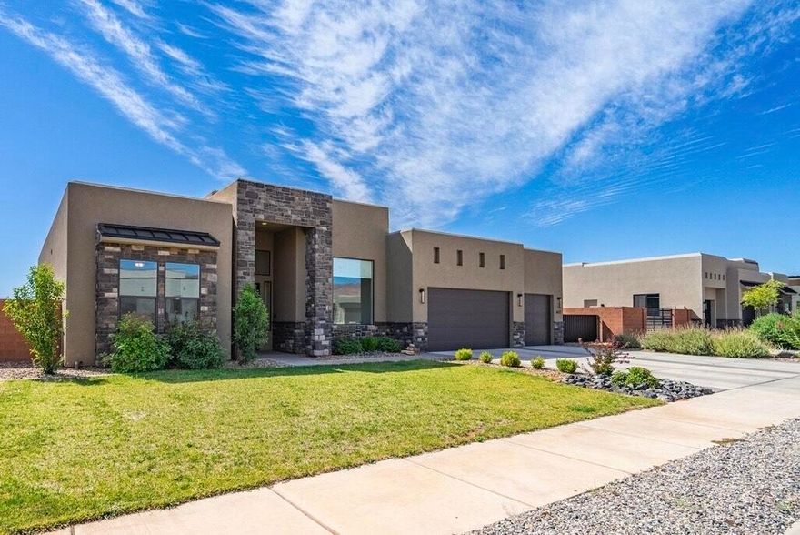 This premier property in Ivins offers everything. Located in the peaceful Anasazi Vista neighborhood under star-filled skies, this home features four spacious bedrooms, high ceilings, and an open-concept great room and kitchen. The fixed picture windows showcase stunning views of the red cliffs and sunsets over the Utah Hills. Well-maintained and move-in ready, this home is easy to show.