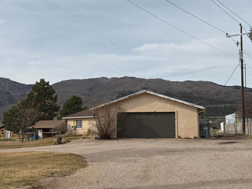 Located in the peaceful community of New Harmony at the base of the Pine Valley Mountains, this one-acre horse property offers privacy while remaining just minutes from I-15 and town.  The 1,700 ft home, built in 1993, sits on a paved county road with year round access and enjoys cooler summer temperatures and fresh mountain air.  Plenty of room to expand, add outbuildings, or simply enjoy the open space and animal privileges.  A rare opportunity to own usable land in a beautiful setting.  Home also has a 2 car garage, tack shed for horses an plenty of room for the RV, boat, toys, or a detached garage.  Call with any questions