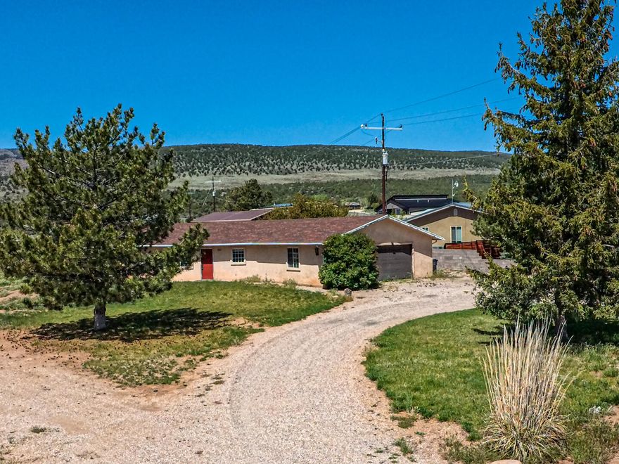 Located in the peaceful community of New Harmony at the base of the Pine Valley Mountains, this one-acre horse property offers privacy while remaining just minutes from I-15 and town.  The 1,700 ft home, built in 1993, sits on a paved county road with year round access and enjoys cooler summer temperatures and fresh mountain air.  Plenty of room to expand, add outbuildings, or simply enjoy the open space and animal privileges.  A rare opportunity to own usable land in a beautiful setting.  Home also has a 2 car garage, tack shed for horses an plenty of room for the RV, boat, toys, or a detached garage.  Call with any questions
