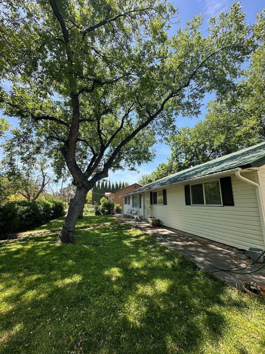 Location! Location! Location! Historic Toquerville, Utah serves as the northern gateway to picturesque Zion National Park. Being 30 miles South of Cedar City and 20 miles North of St. George, you are surrounded by all modern amenities while living in a spectacular natural setting! Get out of the rat race and be a short drive from beautiful red rocks, amazing hiking, biking, canyoneering, backpacking, ATV riding, swimming and a multitude of outdoor activities! This newly renovated three-bedroom, two-bathroom, open concept rambler is nestled in the heart of Toquerville, Utah. If privacy appeals to you, you'll find it here! This home boasts a private, fully fenced corner lot surrounded by mature trees, featuring a covered patio making it great for entertaining! The gorgeous, large shade tree s (including pecan, cherry, plum apricot and almond) attract many beautiful migratory birds and provide a perfect escape/retreat after a long day of work or adventure. Pride of ownership is evident with this home. Many recent renovations have been completed and there are too many to list. A few notable renovations include a brand-new ECO BEE HVAC system, new LVP and Tile flooring throughout, new paint and total bathroom renovations including the primary en suite with luxury shower and free-standing soak tub makes you feel like you're at a luxury spa! The HUGE detached garage is perfect for an auto body or wood-working shop and is large enough to store everything you need for recreation and outdoor adventures! The garage is equipped with 220 voltage outlets and two 10' garage bay doors. For convenience, the garage also features its own private bathroom, electrical panel and swamp cooler. The RV pad adds extra space for all your toys! SO many options with this garage! Dream Big! The smaller shed in the backyard is also equipped with its own water, drain, air-conditioning and electrical panel which makes it perfect for additional storage, living and/or project space. Hello man cave or she-shed!! Income producing potential exists with this home! Given its proximity to the National Park and all other recreational areas, short term, nightly rental options may exist. Airbnb requests must be approved by the city. Whether it's your dream property or an investment opportunity, you'll absolutely love this home and all it has to offer! Please note, square footage figures are provided as a courtesy estimate only and were obtained from past appraisal records. Buyer is advised to obtain an independent measurement. Buyer to verify ALL information.