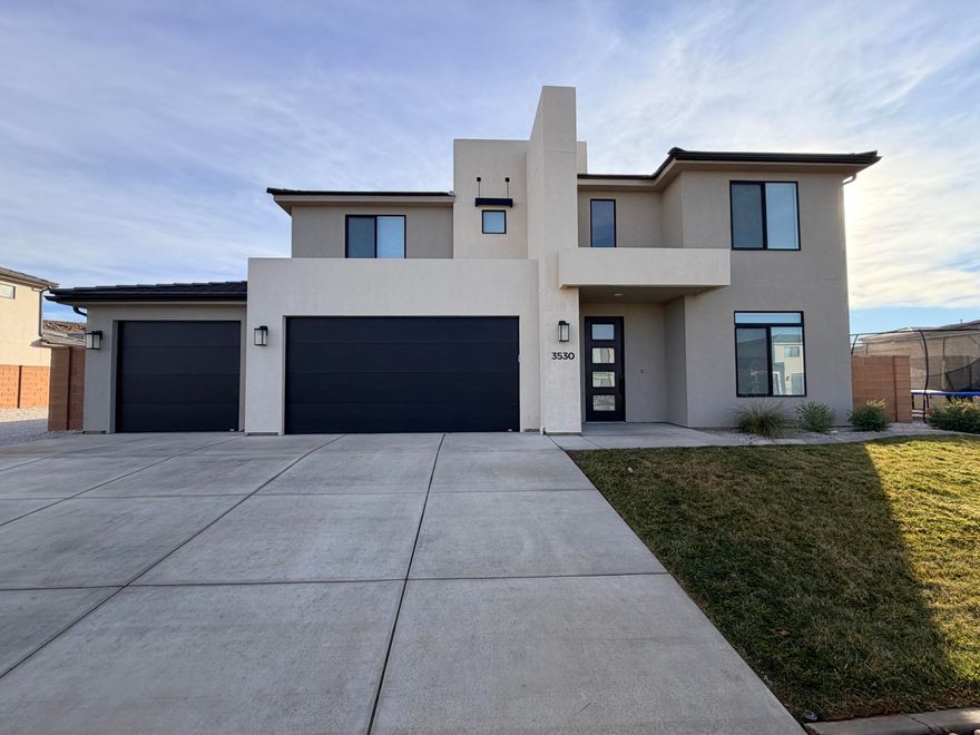 **$10k Price Drop** Welcome to this beautifully newly built home in the desirable Little Valley area of St. George, where modern design meets everyday comfort. This spacious residence offers 4 bedrooms, 3.5 bathrooms, and over 2,800 sq. ft. of thoughtfully designed living space. The main-floor primary suite provides convenience and privacy, while a formal living room or home office adds flexibility. The open-concept kitchen features quartz countertops, stainless steel appliances, a built-in wall oven, gas range, and updated lighting--perfect for entertaining. Upstairs, enjoy a large bonus room ideal for a media or playroom. The garage is equipped with a brand-new mini split system, keeping it cool during hot St. George summers! A massive RV pad with sewer cleanout, water, and potential power hookup is a rare find. The backyard is a blank slate, ready for your vision. Walking distance to South Mesa Elementary. Don't miss this Little Valley opportunity!