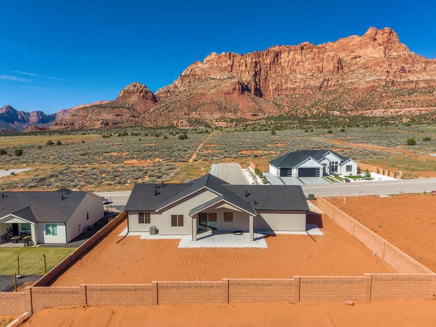**Seller financing is an option with 20% down**Introducing a stunning new home in the prestigious Heights Subdivision! This thoughtfully designed 3-bedroom, 2-bathroom home offers breathtaking red rock mountain views, a spacious 2-car garage, and RV parking for all your toys. The gourmet kitchen will include custom white cabinetry, quartz countertops, oven range, and dishwasher, perfect for cooking, baking, and entertaining. Upgraded lighting fixtures highlight the abundant natural light, while durable LVP flooring flows through the main living areas and cozy carpet creates comfort in the bedrooms. The vaulted primary suite is a true retreat, with windows framing gorgeous views and a luxurious ensuite featuring dual vanities, a designer shower, and a relaxing soaker tub. Outside, the partially landscaped yard with fencing provides a private oasis for family, pets, and gatherings. Nestled at a 5,000 ft elevation, this home is surrounded by stunning terrain and a favorable climate. Located just off the edge of town, you'll be close to riding and hiking trails, 5 National Parks, Sand Dunes, and within a short drive to Lake Powell (90 minutes), the Grand Canyon (60 minutes), Zion (45 minutes), Kanab (30 minutes), and St. George (40 minutes). Make this extraordinary home yours today.