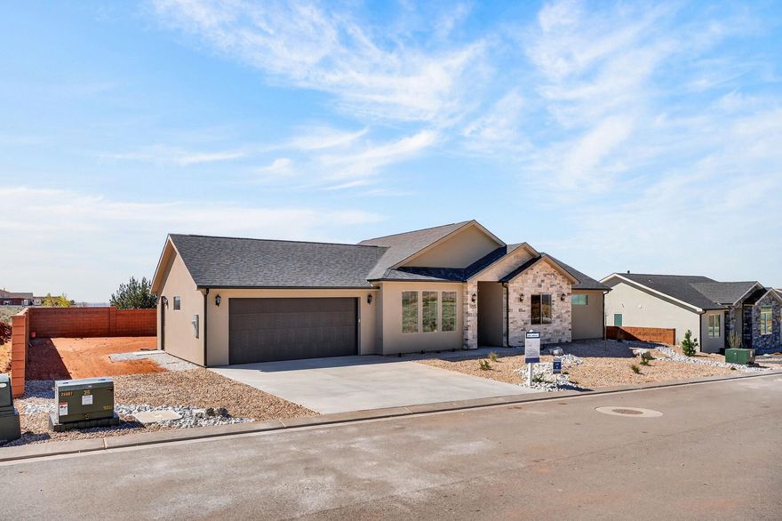 **Seller financing is an option with 20% down**Introducing a stunning new home in the prestigious Heights Subdivision! This thoughtfully designed 3-bedroom, 2-bathroom home offers breathtaking red rock mountain views, a spacious 2-car garage, and RV parking for all your toys. The gourmet kitchen will include custom white cabinetry, quartz countertops, oven range, and dishwasher, perfect for cooking, baking, and entertaining. Upgraded lighting fixtures highlight the abundant natural light, while durable LVP flooring flows through the main living areas and cozy carpet creates comfort in the bedrooms. The vaulted primary suite is a true retreat, with windows framing gorgeous views and a luxurious ensuite featuring dual vanities, a designer shower, and a relaxing soaker tub. Outside, the partially landscaped yard with fencing provides a private oasis for family, pets, and gatherings. Nestled at a 5,000 ft elevation, this home is surrounded by stunning terrain and a favorable climate. Located just off the edge of town, you'll be close to riding and hiking trails, 5 National Parks, Sand Dunes, and within a short drive to Lake Powell (90 minutes), the Grand Canyon (60 minutes), Zion (45 minutes), Kanab (30 minutes), and St. George (40 minutes). Make this extraordinary home yours today.