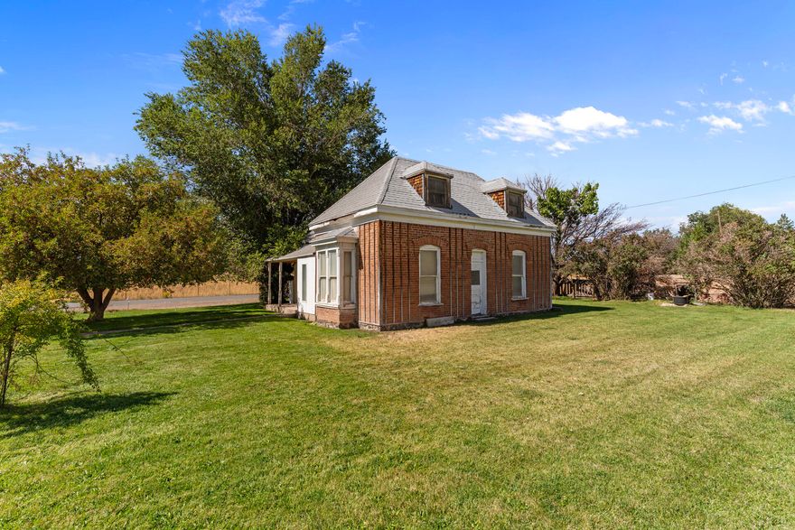 This historic 3 bedroom, 1 bath brick home, built in 1893, is a true fixer-upper in the heart of Beaver, Utah. It is not livable in its current condition and will require a full renovation, but for the right buyer it holds strong potential. The solid brick exterior and spacious yard provide a foundation to build on, while the interior has not been updated since the 1960s and is ready for a complete reimagining. Located within walking distance of The Creamery, a regional favorite for fresh cheese and ice cream, the property also offers easy access to Eagle Point Ski Resort, Beaver Canyon, Fishlake National Forest, and recreation that draws visitors year-round. With its small-town setting, tree-lined streets, and central location, this property could make an excellent short-term rental.