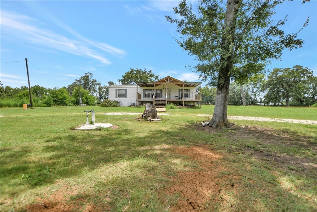 Photo of 8691 River Oaks Drive, Midway, TX 75852 (MLS # 26009390)