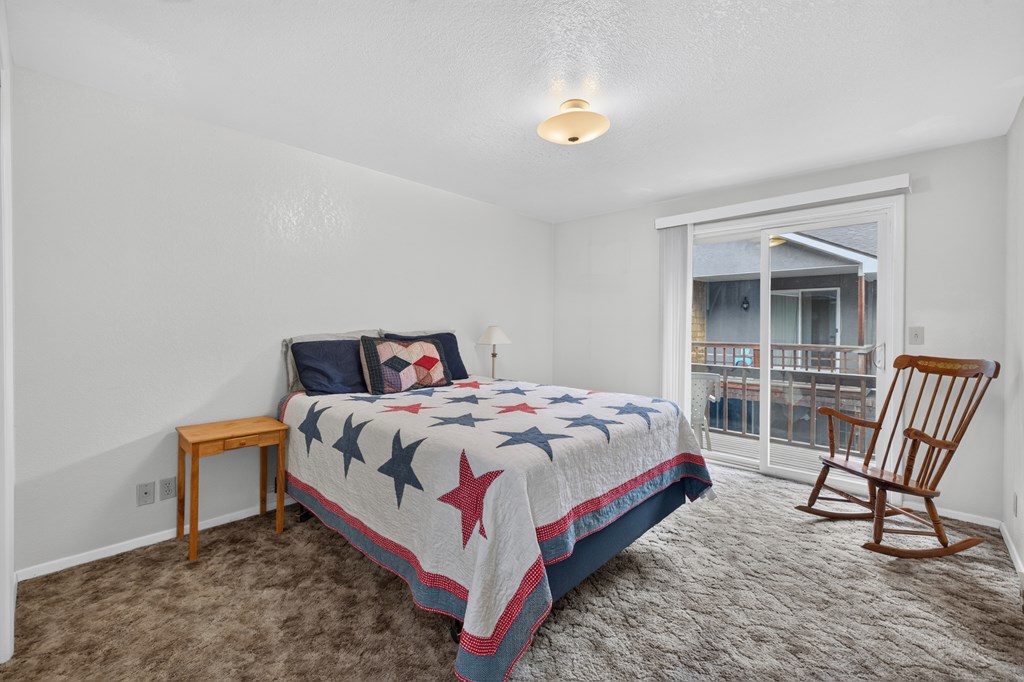 Primary Bedroom, Primary bedroom with private balcony.