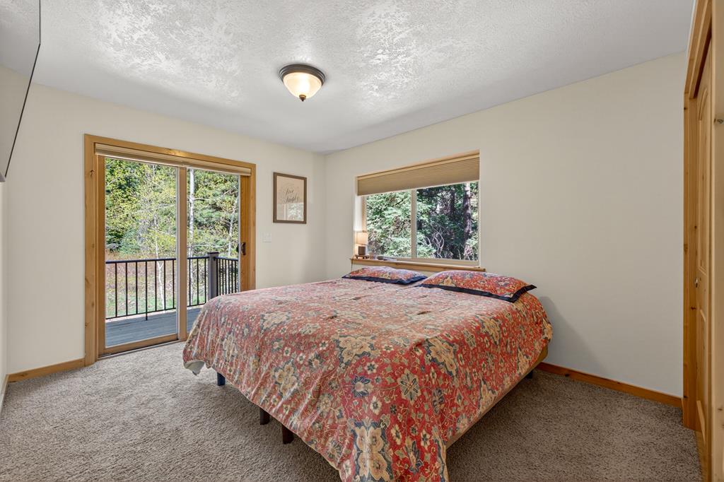 One of two upstairs guest rooms that both access the shared balcony.