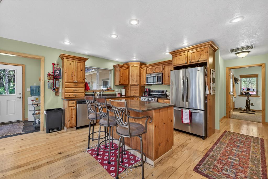 The Kitchen, With Granite, Stainless, Alder cabinets and hickory floors.