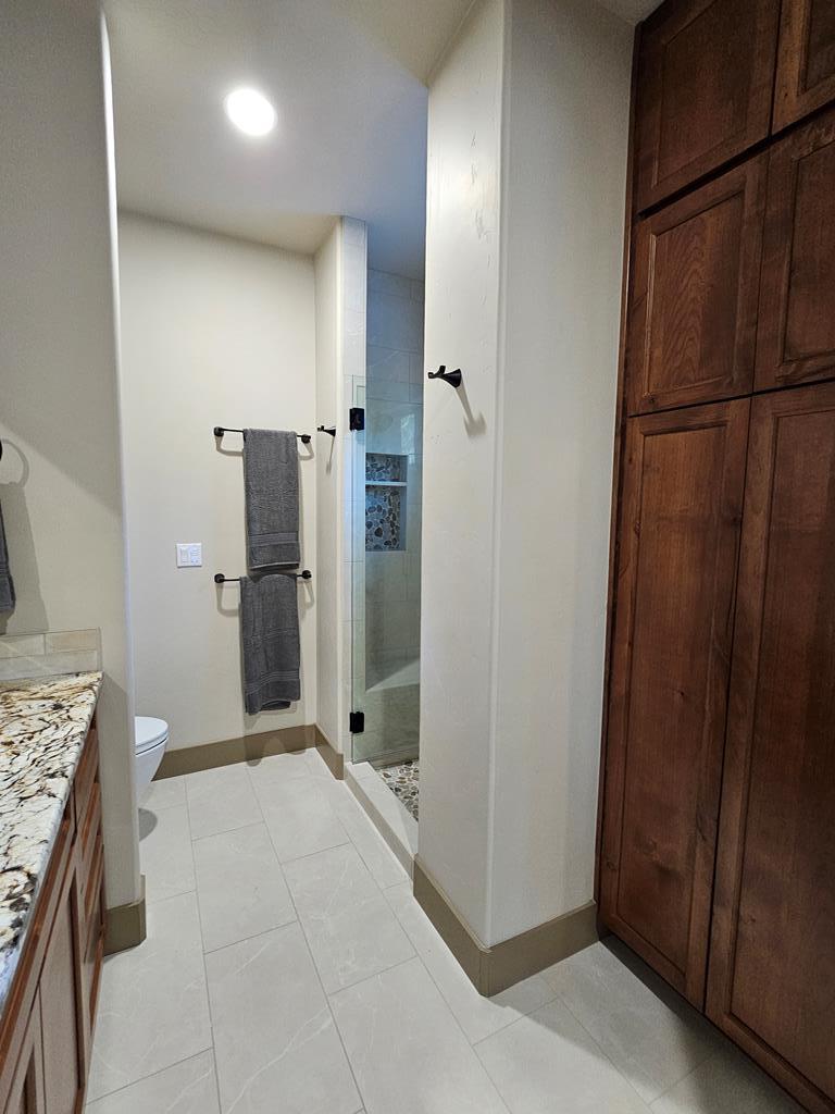 Full size linen closet.