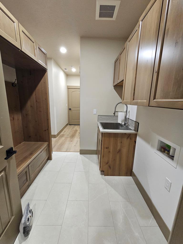 Laundry/mudroom., Accessed off hallway from garage.
