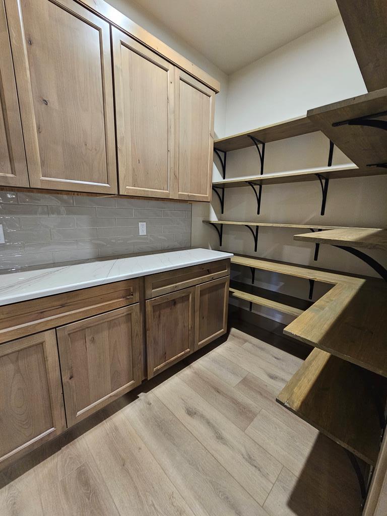 Generous butler's pantry., Loads of shelving, cabinets and room for appliances & a microwave.