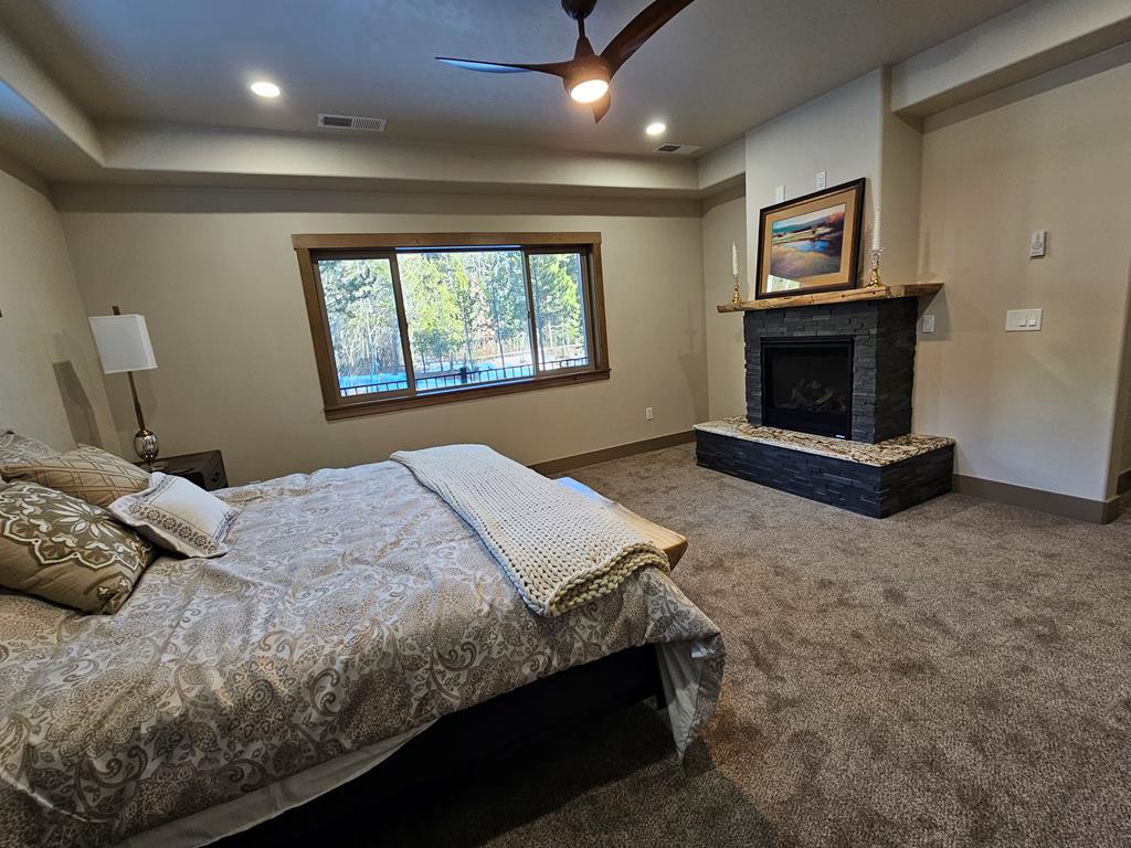 Propane fireplace in primary., Ceiling fan moves the air to warm in the summer and cool in the winter.