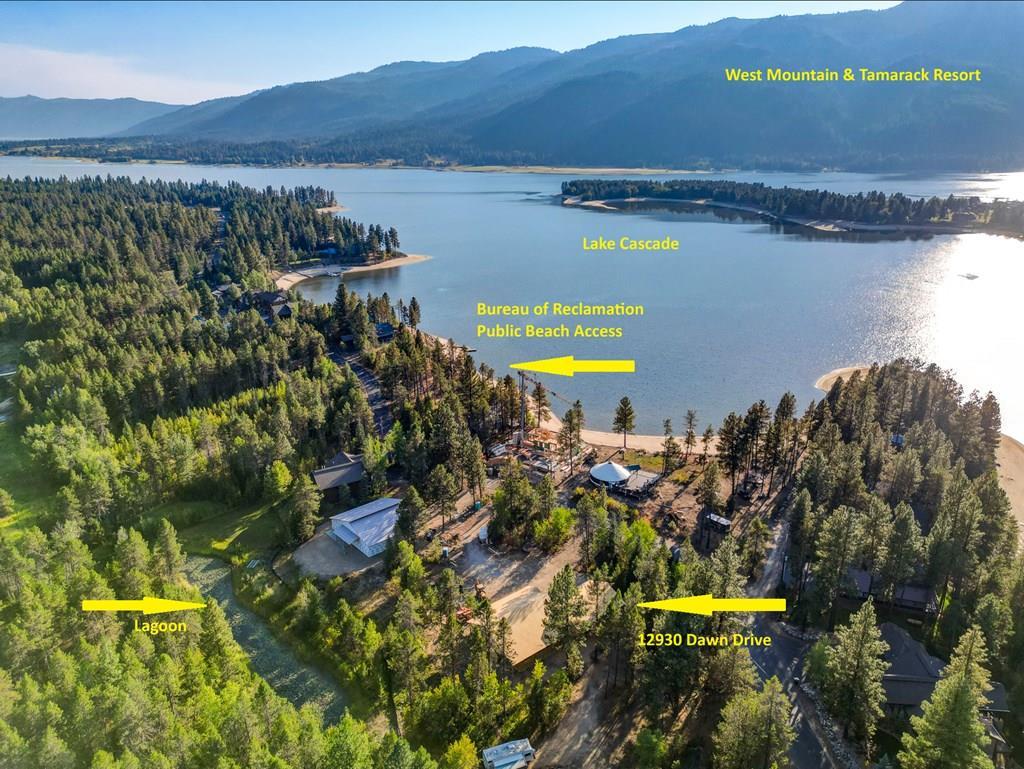 Backs up to private land, lake across the street.