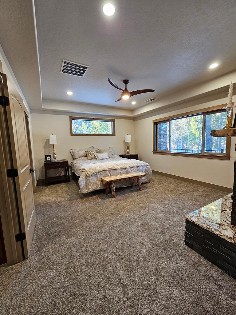 Coffered ceiling., Coffered ceiling in the primary bedroom with plenty of can lights.