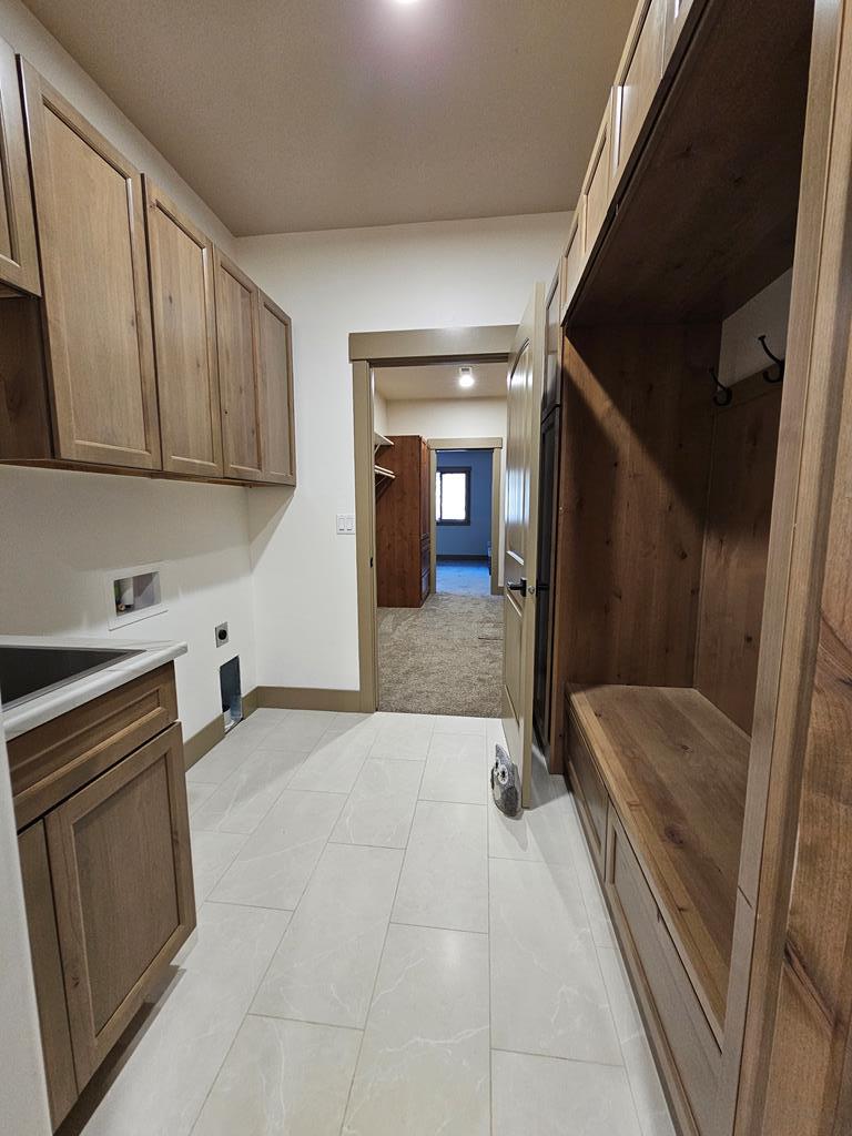 Laundry room, Has door connecting it to the primary bedroom walk in closet.