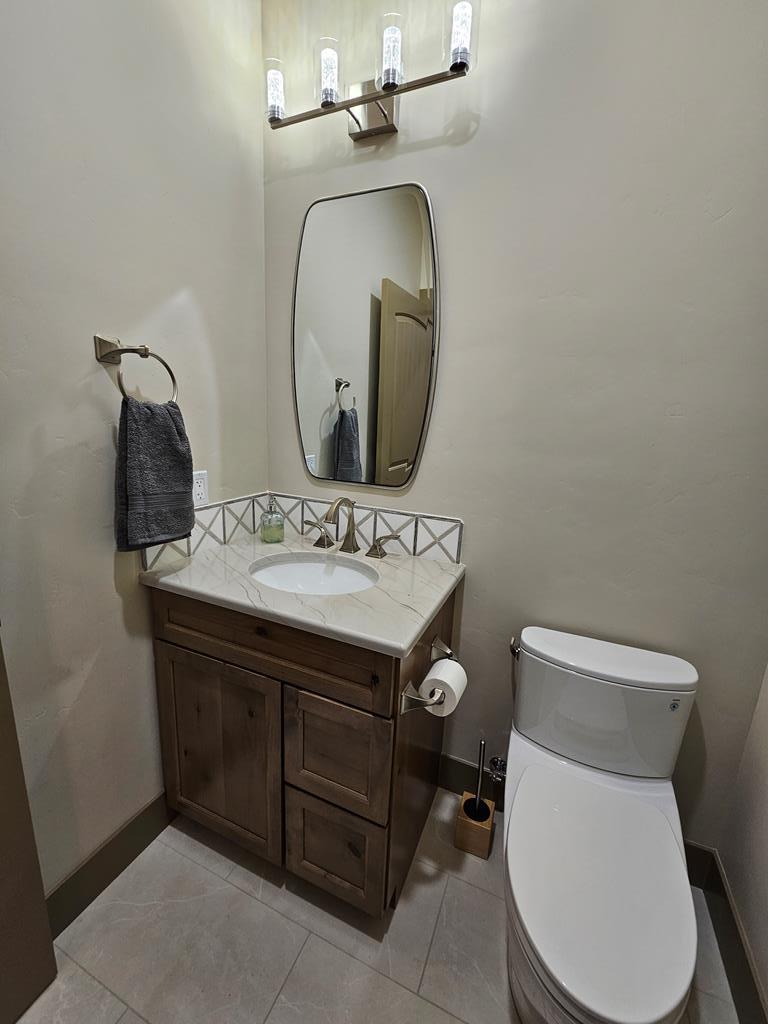 Powder bathroom off entry., Accessed off of kitchen/living/dining area.