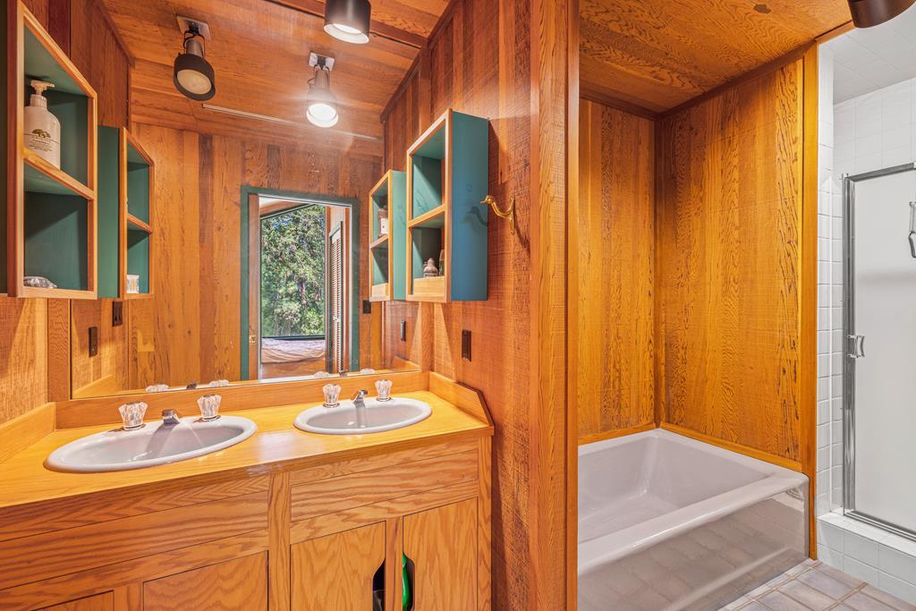 Bathroom in second bunk room., Dual vanities, bath tub and walk in shower.