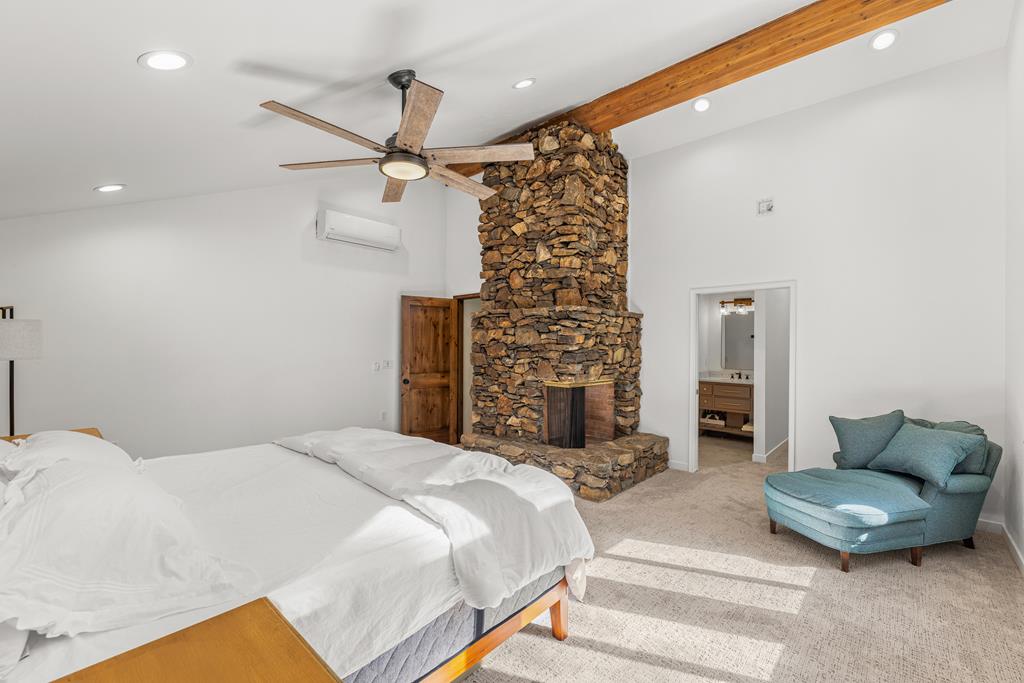 Primary bedroom., Vaulted ceilings and large ceiling fan.