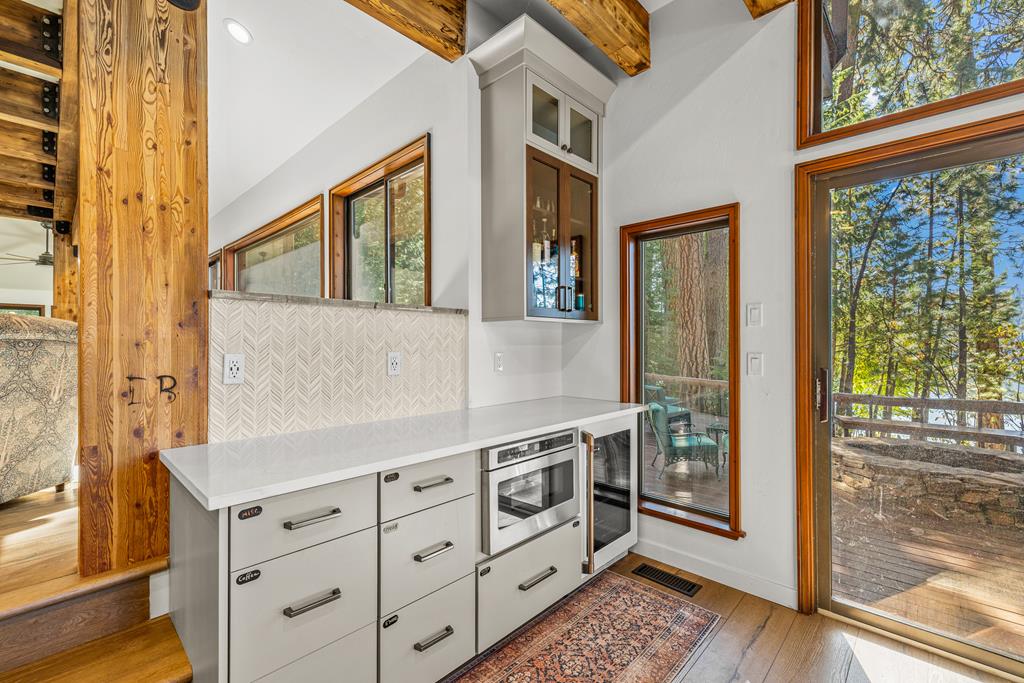 Kitchen bar area., Microwave and beverage fridge located here.