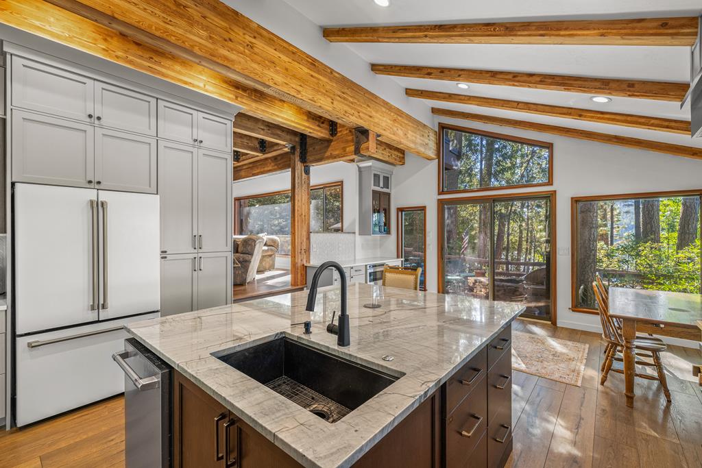Sink in the island., Granite topped island. Solid wood cabinets throughout.