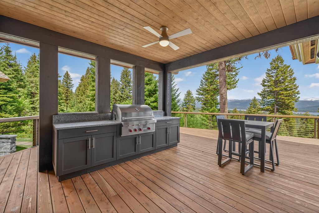 Outdoor Kitchen with Built-In Wolf BBQ, The Outdoor Kitchen also a Sunbrite TV and Subzero wine/ beverage refrigerator.