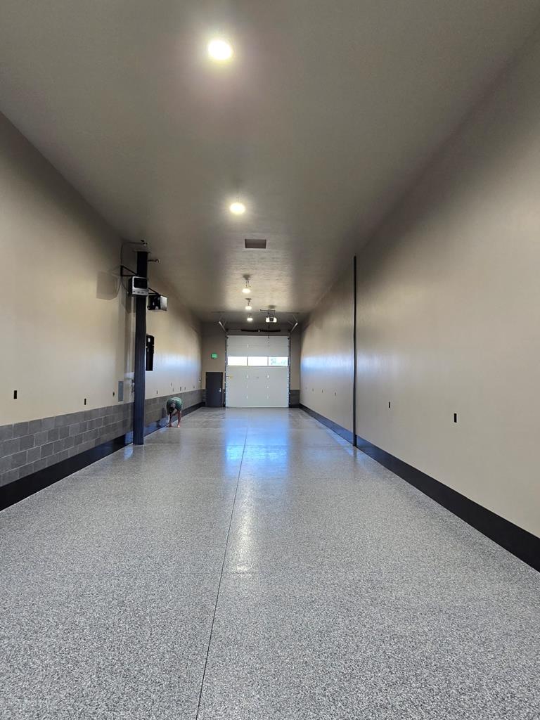 Double pull through unit is 20' by 100'., With optional epoxy floors, central vac and black diamond plate baseboards