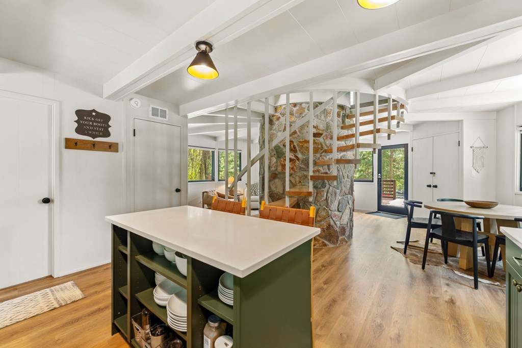 The kitchen island, Open shelving in the island offers convenient additional storage.