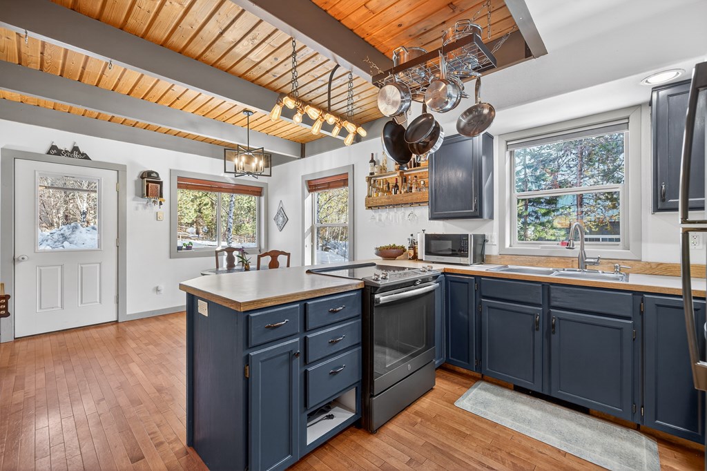 Painted wood cabinets in kitchen