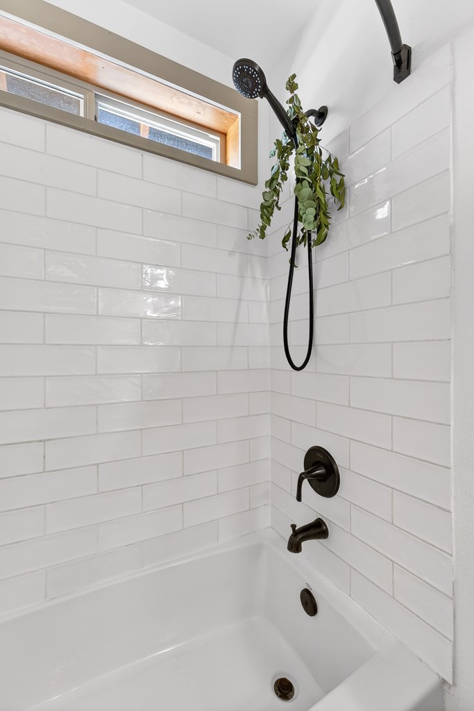 Black appliances, subway tile.