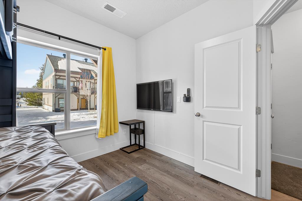 Large window in ground floor bedroom.