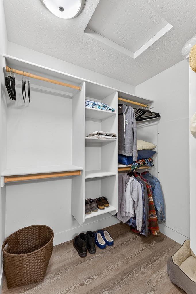 Wlak in closet in primary bathroom.