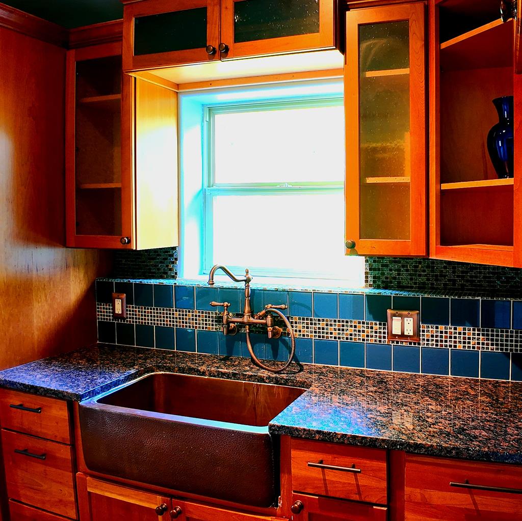 copper farm sink in laundry