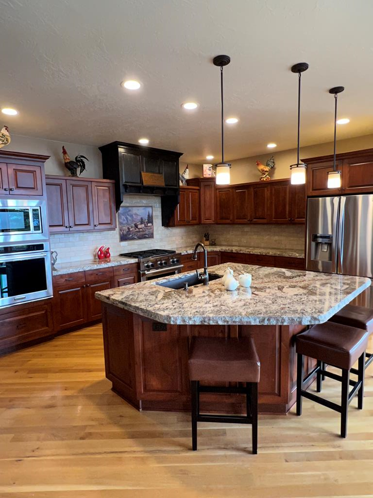 Kitchen with large granite top island