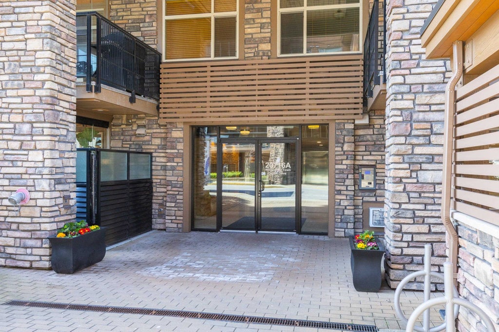 Photo of 20716 Willoughby Town Centre Drive #A102, Langley, BC V2Y 3J7 (MLS # R3095077)