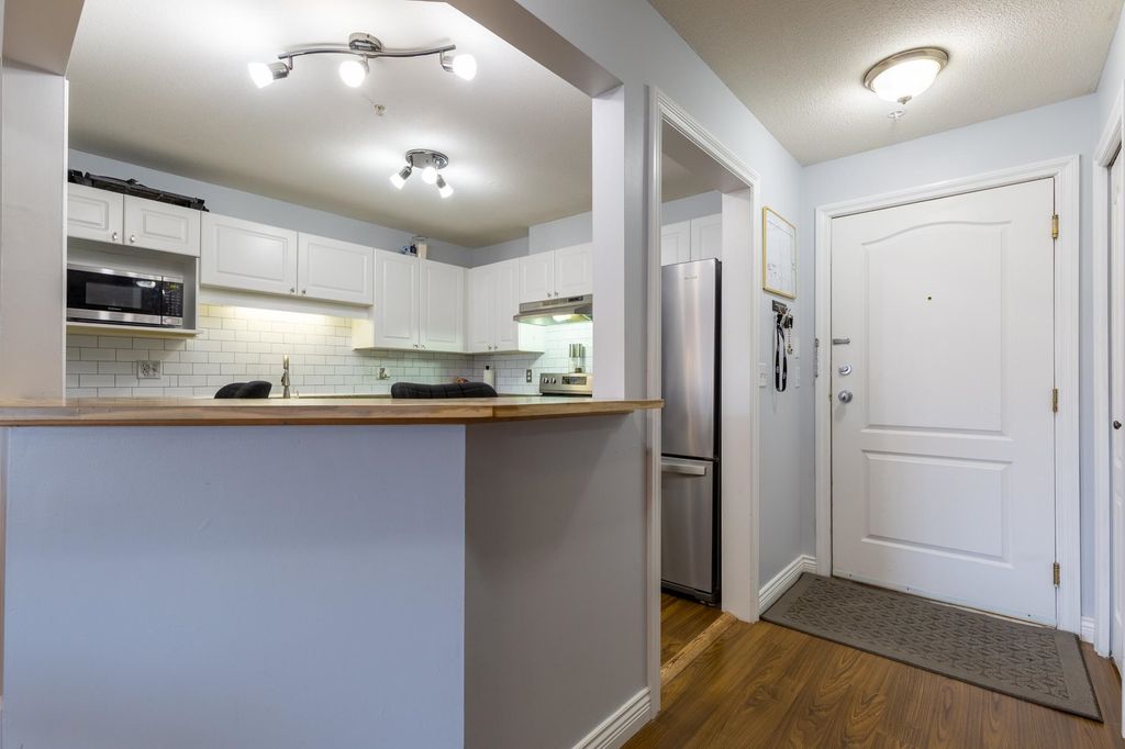 Photo of 5765 Glover Road #201, Langley, BC V3A 8M8 (MLS # R3089355)