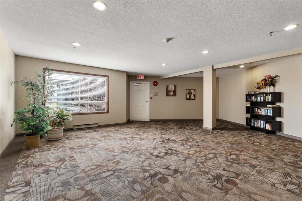 Photo of 5710 201 Street #201, Langley, BC V3A 8A8 (MLS # R3162018)