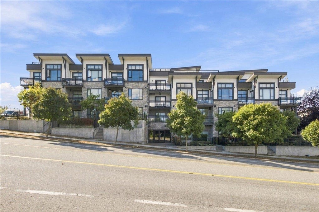 Photo of 9983 E Barnston Drive #309, Surrey, BC V4N 6T3 (MLS # R3166132)