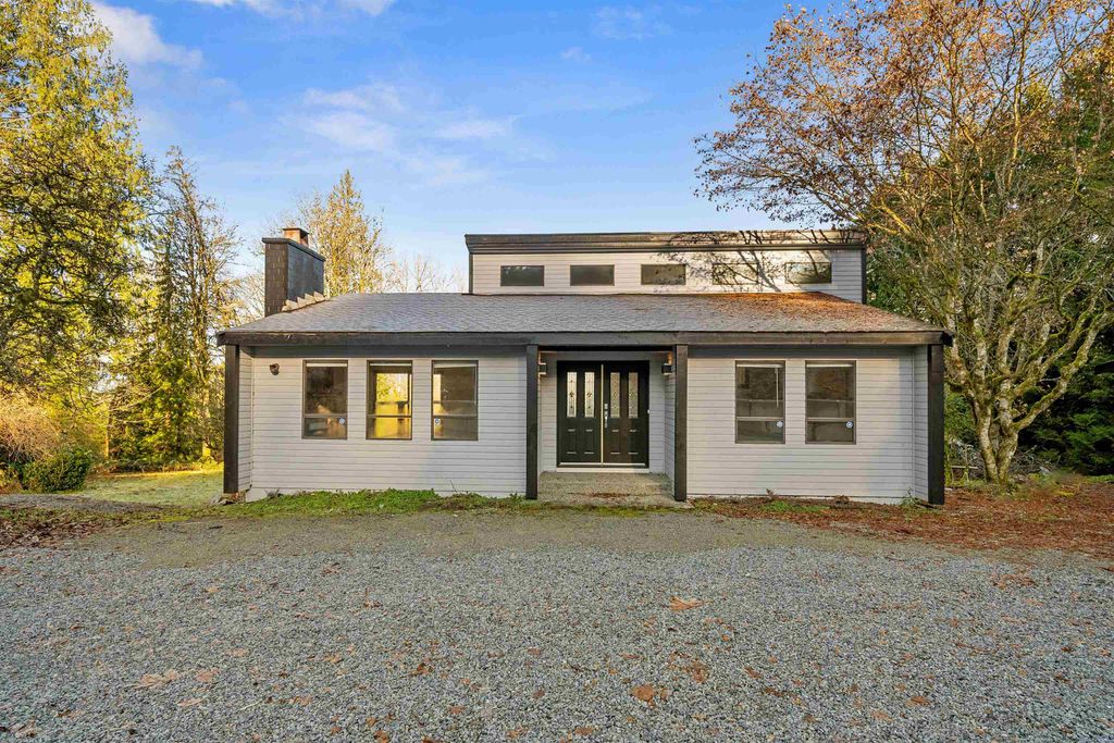 Photo of 25443 Bosonworth Avenue, Maple Ridge, BC V2W 1G9 (MLS # R3107428)