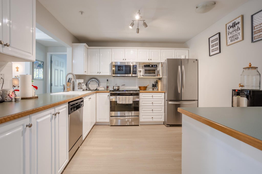 Photo of 6557 121 Street #205, Surrey, BC V3W 1E7 (MLS # R3172176)