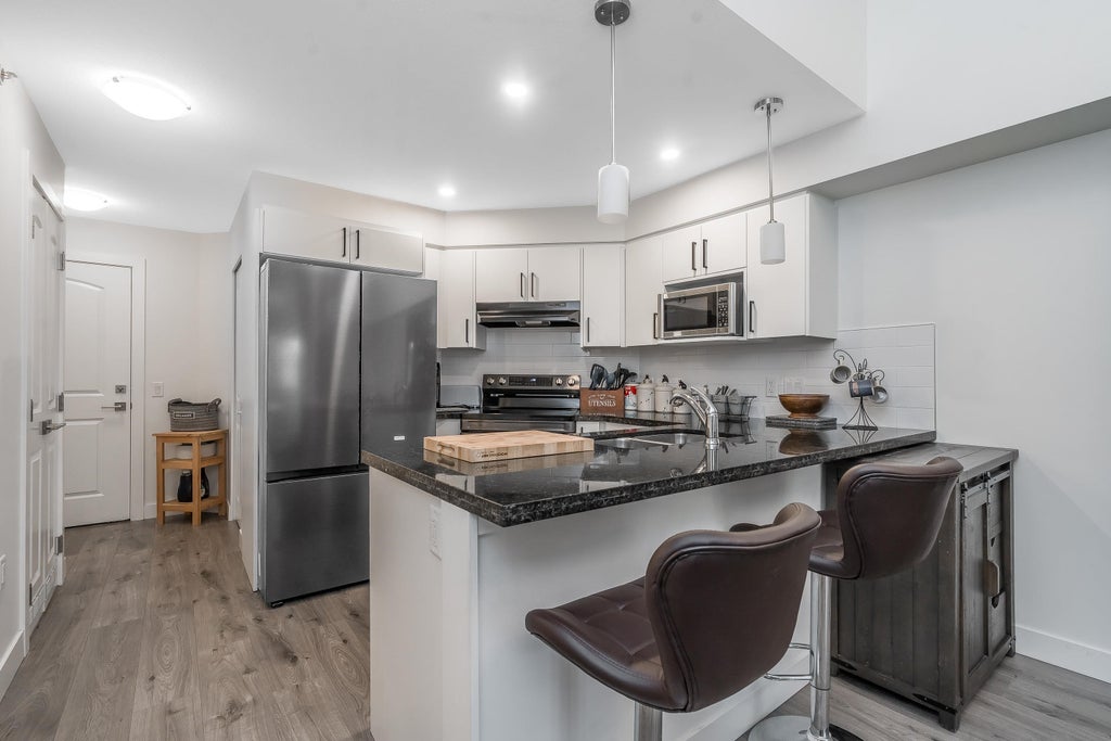 Photo of 19730 56 Avenue #410, Langley, BC V3A 3X6 (MLS # R3176515)