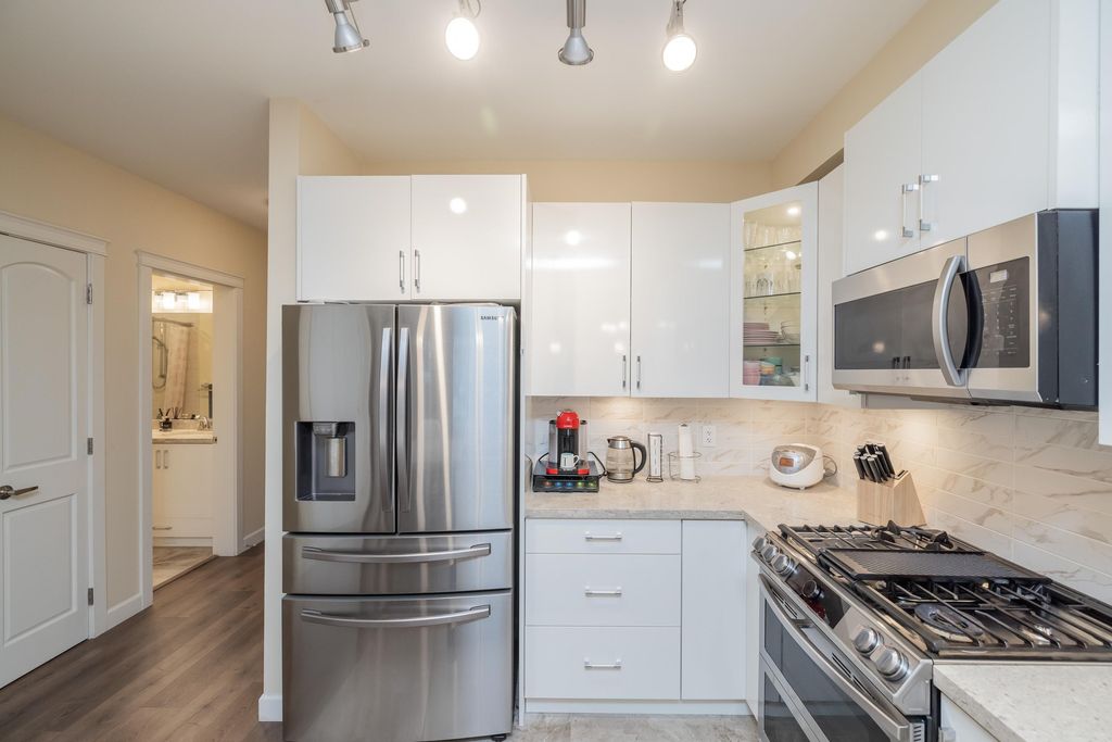 Photo of 8538 203a Street #111, Langley, BC V2Y 3P9 (MLS # R3115091)