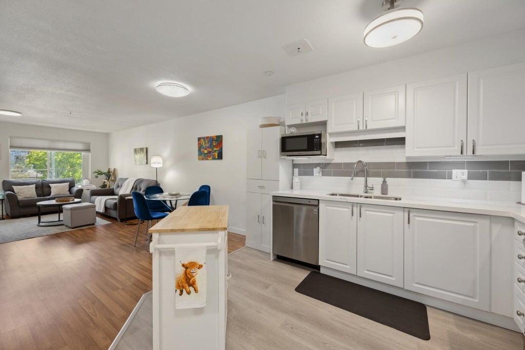 Photo of 5765 Glover Road #202, Langley, BC V3A 8M8 (MLS # R3158124)