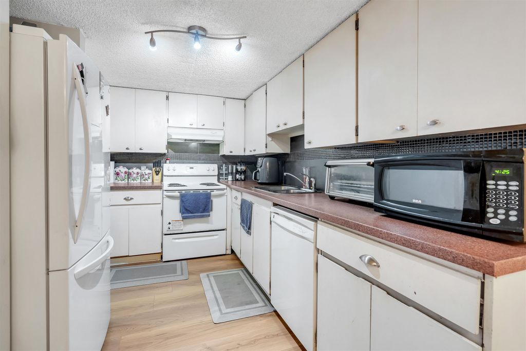 Photo of 7116 133b Street #105, Surrey, BC V3W 8A4 (MLS # R3089403)