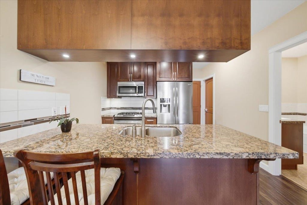 Photo of 8067 207 Street #317, Langley, BC V2Y 0N9 (MLS # R3143358)