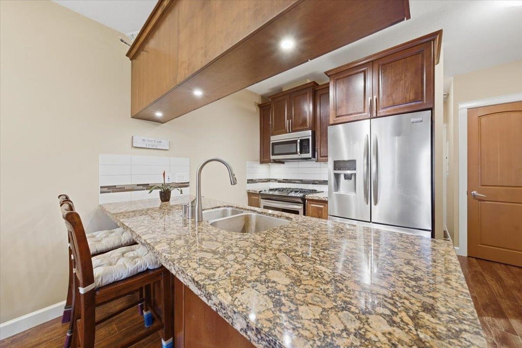 Photo of 8067 207 Street #317, Langley, BC V2Y 0N9 (MLS # R3143358)