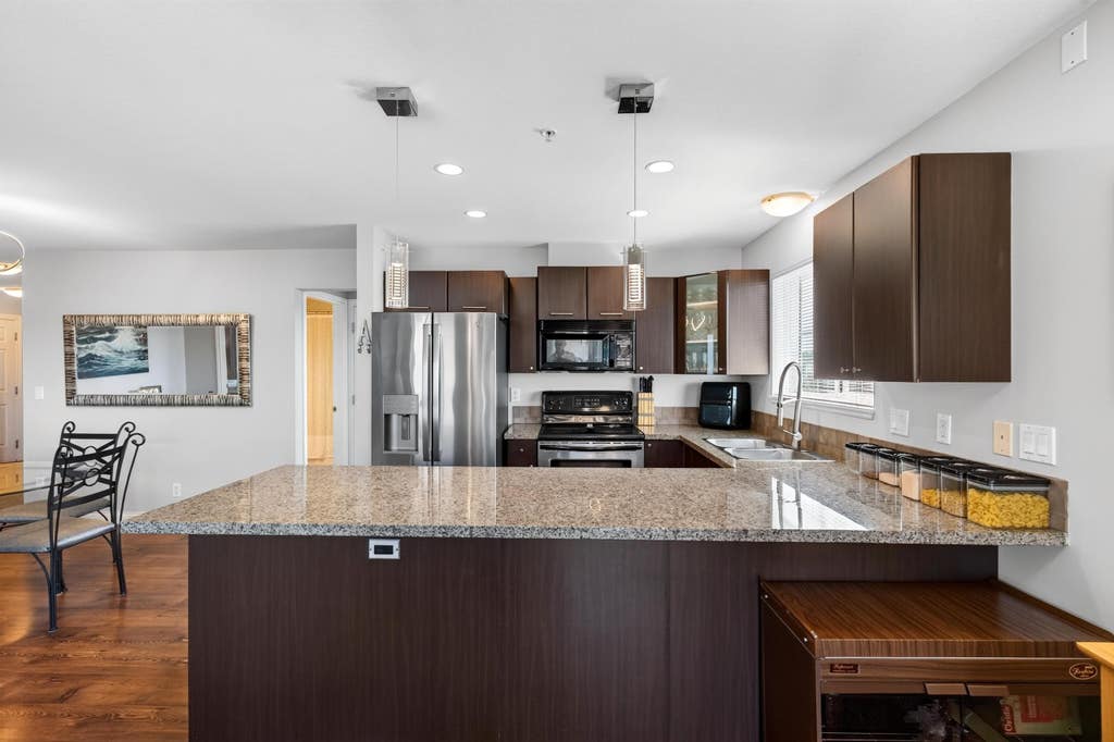 Photo of 5488 198 Street #412, Langley, BC V3A 1G2 (MLS # R3156598)
